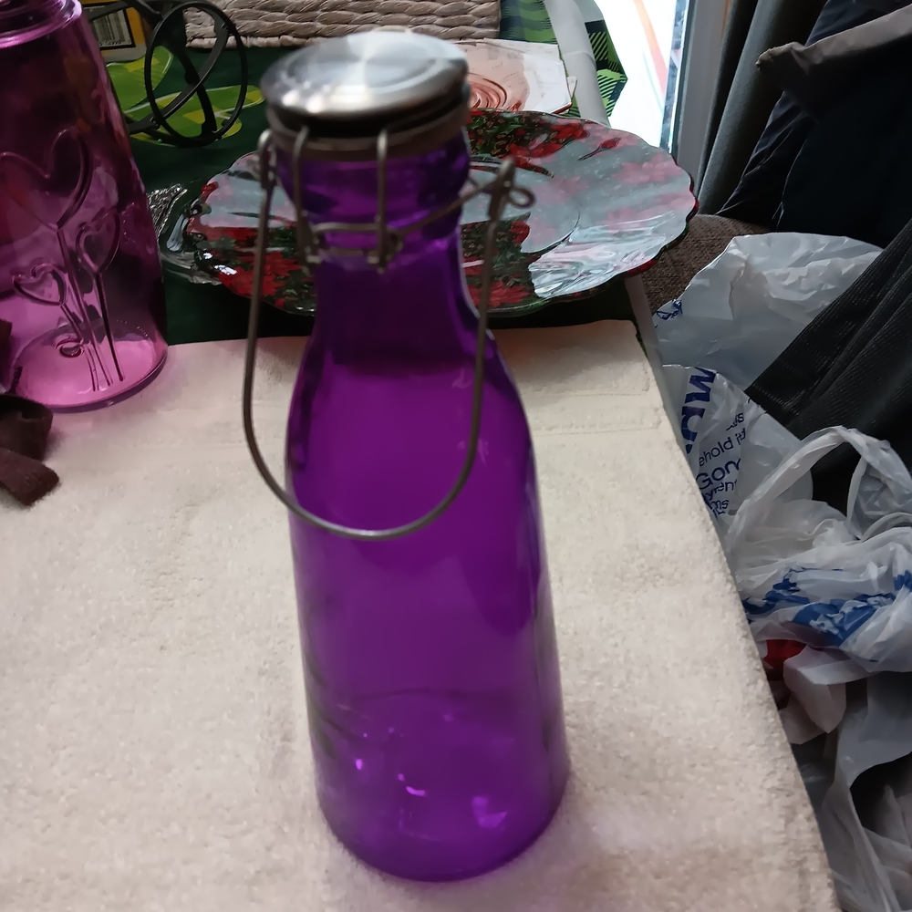 Vibrant Purple Glass Bottle with Secure Metal Closure